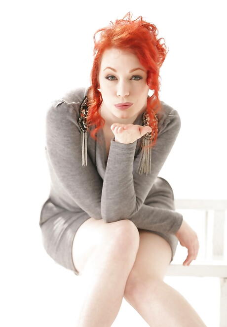 Curious red-haired milf Justine Jolie shows her ass 