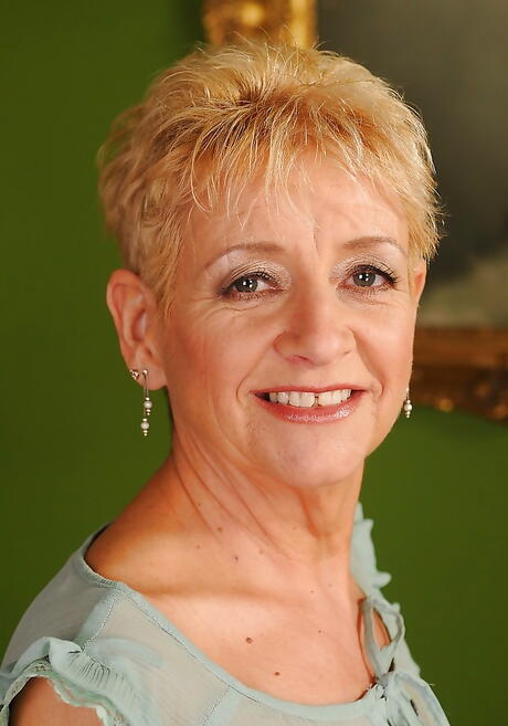 Deluxe grannie Autumn Leaf in fancy skirt exhibits her butt 